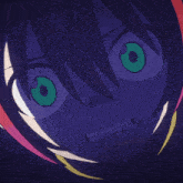 a blurry image of a person 's face with green eyes