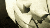 a computer generated image of a white object with a shadow on it
