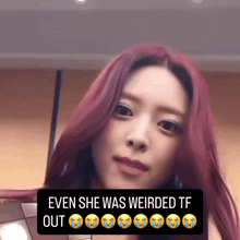 a woman with red hair and a caption that says even she was weirded out