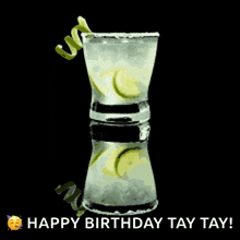 a happy birthday greeting card with a shot glass of liquor