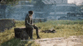 a man sits on a box in a field and says " by some miracle " in a video game