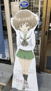 a cardboard cutout of a girl with a green skirt and white shirt