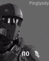 a black and white photo of a man wearing a helmet with the word no written on it