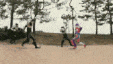 a group of people in costumes are running in a field