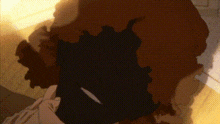 a close up of a person 's head with a shadow of a person on it .
