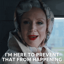 a woman wearing a scarf on her head says i 'm here to prevent that from happening