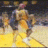 a blurry picture of a basketball game with a player wearing the number 24