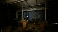 a blurry picture of a dark room with a light shining through a window