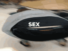 a blurry picture of a person 's butt with the word sex written on it