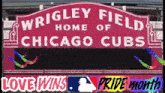 a sign for wrigley field home of the chicago cubs says pride month