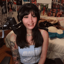 a woman wearing headphones and a shirt that says oham 20