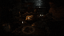 a dark room with a person laying on the ground