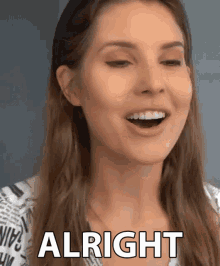 a woman with her mouth open and the word alright behind her