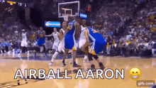 a group of basketball players on a court with the words airball aaron on the bottom .