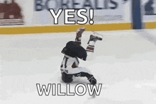 a hockey player is laying on his back on the ice and says `` yes ! willow '' .