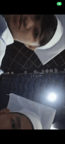 a man and a woman are standing next to each other with a green button on the bottom right that says 9