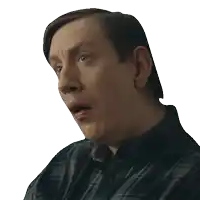 a man in a plaid shirt has his mouth open