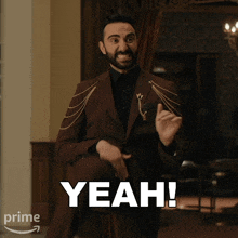 a man in a suit says yeah in white