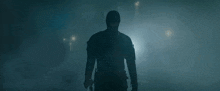 a man in a mask is holding a gun in a dark room .