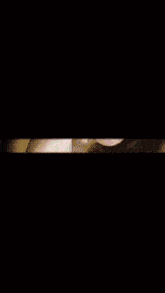 a woman 's face is surrounded by a glowing beam of light