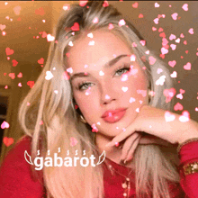 a woman 's face is surrounded by hearts and the word gabarot is below her