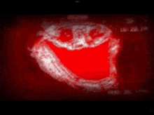 a red background with a white face on it