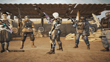 a group of soldiers are standing in front of a target and one of the soldiers has the number 19 on their back