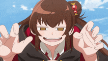 a girl with brown hair is making a face with her hands outstretched