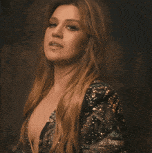 a woman with long hair is wearing a black dress