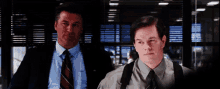 two men in suits and ties are standing next to each other with the words maybe written on the screen