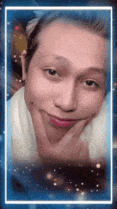 a close up of a person 's face with a blue border around it