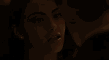 a woman in a dark room with her mouth open