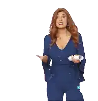 a woman in a blue dress with bell sleeves holds a bottle