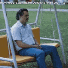 a man is sitting on a swing with a caption that says " you are waiting for denzel to finish your 1 to 1 "