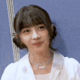 a woman wearing a necklace that says ' sss ' on it