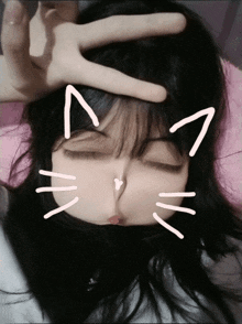a girl is making a peace sign with her hand