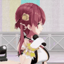 a girl with red hair and a flower in her hair is singing into a microphone