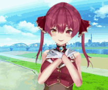 a girl with red hair is standing in front of a river