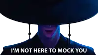 a man wearing a hat with the words " i 'm not here to mock you " above him