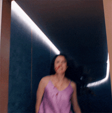 a blurry picture of a woman in a purple dress