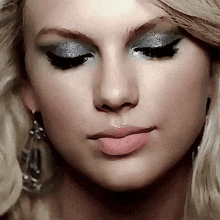a close up of a woman 's face with a pink lip