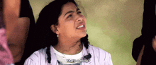 a woman is sitting in a chair with her eyes closed and saying that 's a thing ?