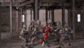 a group of soldiers are fighting each other in an empty building