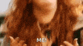 a close up of a woman 's face with red hair and the words `` me ! ''