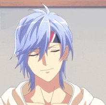 a man with blue hair has a red white and blue bandana around his head