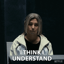 a man in a white jacket is sitting in front of a netflix logo