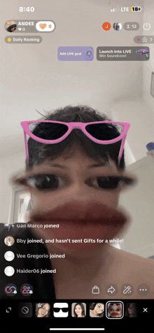 a woman wearing pink sunglasses is on a phone screen with the time of 8:40