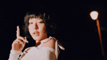 a close up of a woman with short black hair