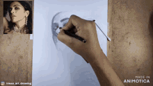 a drawing of a woman 's face is being made in animatica