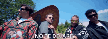 a group of men standing next to each other with no te dejare written on the bottom right